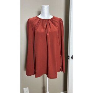 Orange long sleeved top large